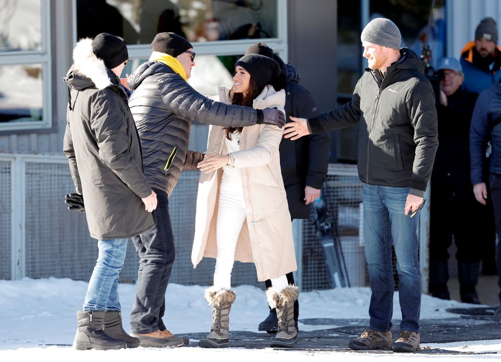 Meghan, Duchess of Sussex and Prince Harry, Duke of Sussex greet Mike Bourgeois and his wife Lori