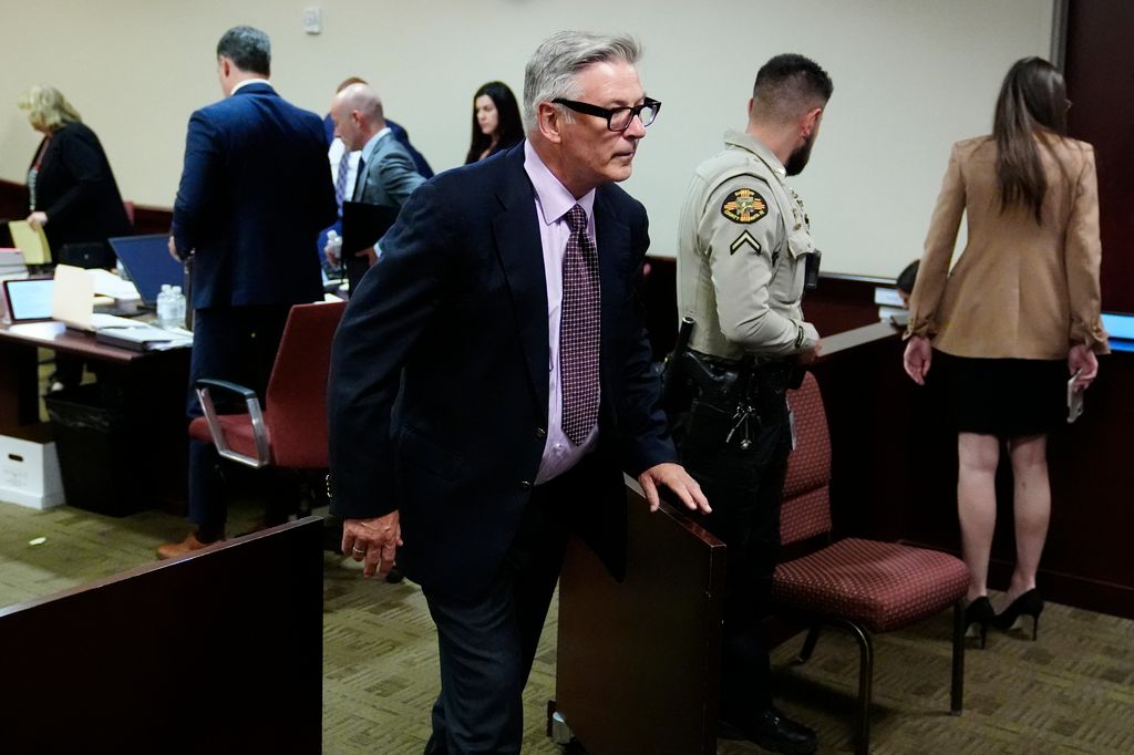 US actor Alec Baldwin leaves the room during a break in his hearing in Santa Fe County District Court on July 10, 2024
