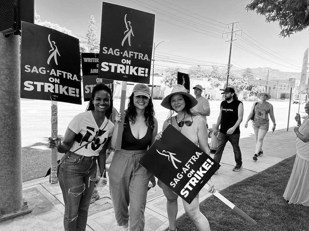 Alyssa Diaz, Melissa O'Neil and Mekia Cox were pictured on the picket lines