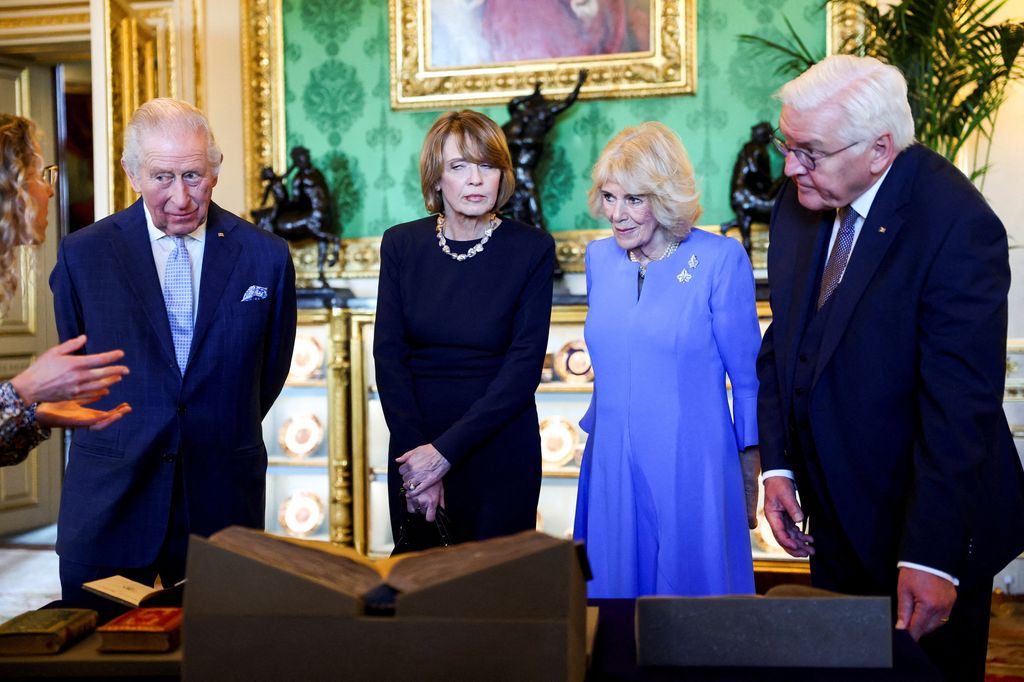 King Charles III, Germany's President Frank-Walter Steinmeier, and Frank-Walter's wife Elke Buedenbender and Queen Camilla view a special exhibition of items relating to Germany from the Royal Collection,  in the Green Drawing Room at Windsor Castle in Windsor, on December 3, 2025