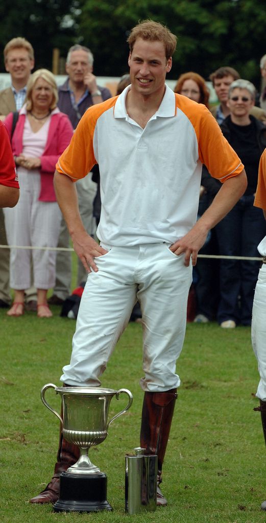 Prince William stands with the cup after winning the polo match between Apes Hill Club Barbados against Churchill Retirement Living for the Calcot Manor Hotel Cup at the Beaufort Polo Club, Westonbirt, near Tetbury on June 17, 2007