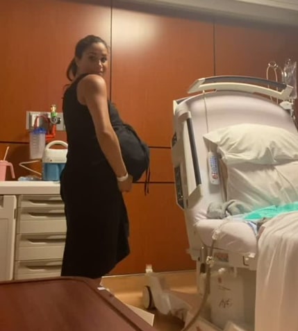 Pregnant Meghan wearing black dress on hospital labour ward