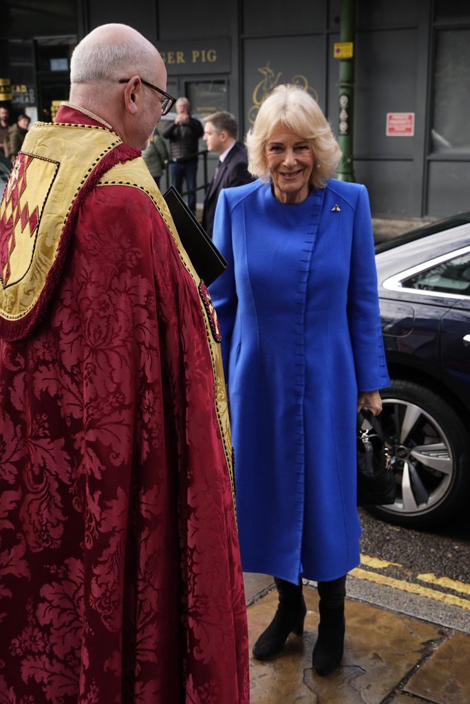 Queen Camilla speaks with Dean of Southwark Mark Oakley ahead of a service of thanksgiving for Dame Jilly Cooper at Southwark Cathedral
