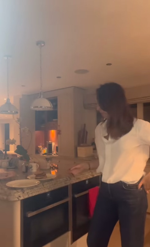 Woman in white shirt in kitchen