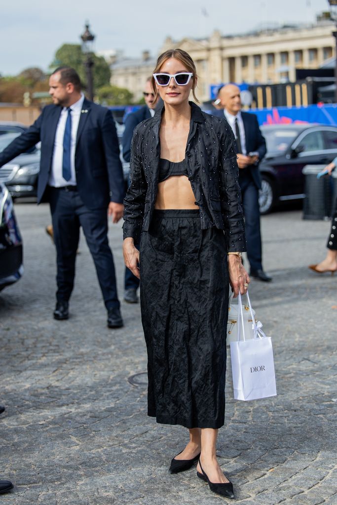 PARIS, FRANCE - SEPTEMBER 26: Olivia Palermo wears black top, jacket, pants, white sunglasses outside Dior during the Womenswear Spring/Summer 2024 as part of Paris Fashion Week on September 26, 2023 in Paris, France. (Photo by Christian Vierig/Getty Images)
