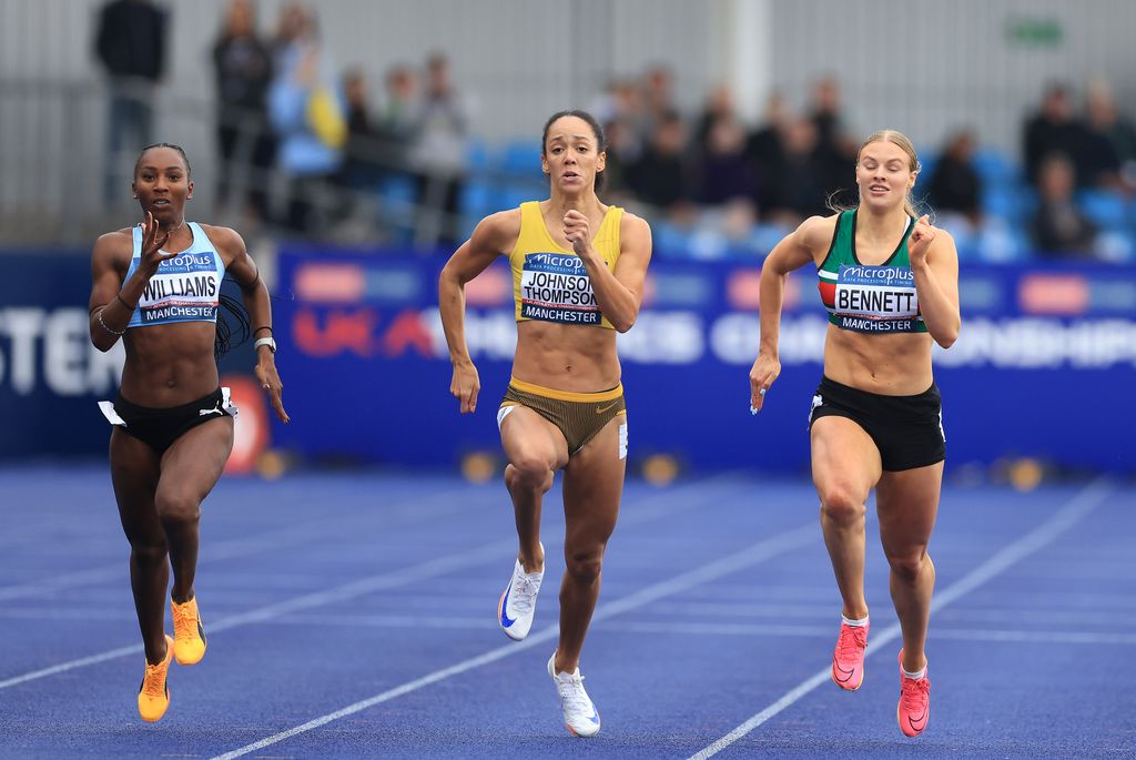 Katarina Johnson-Thompson running alongside two other athletes