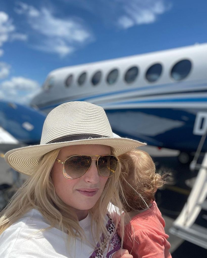 rebel wilson and daughter near private jet