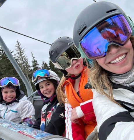 Chelsea Handler taking a selfie on the ski lift with her kids