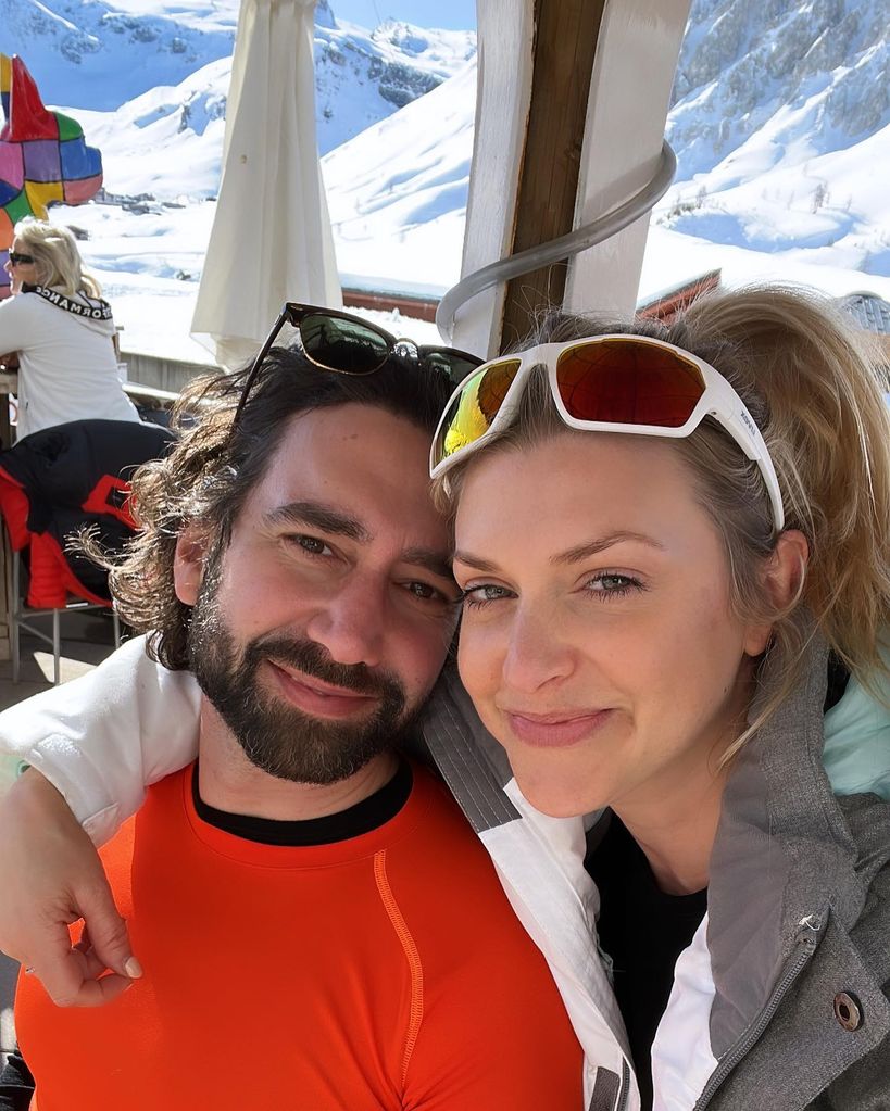 Anna with her husband skiing