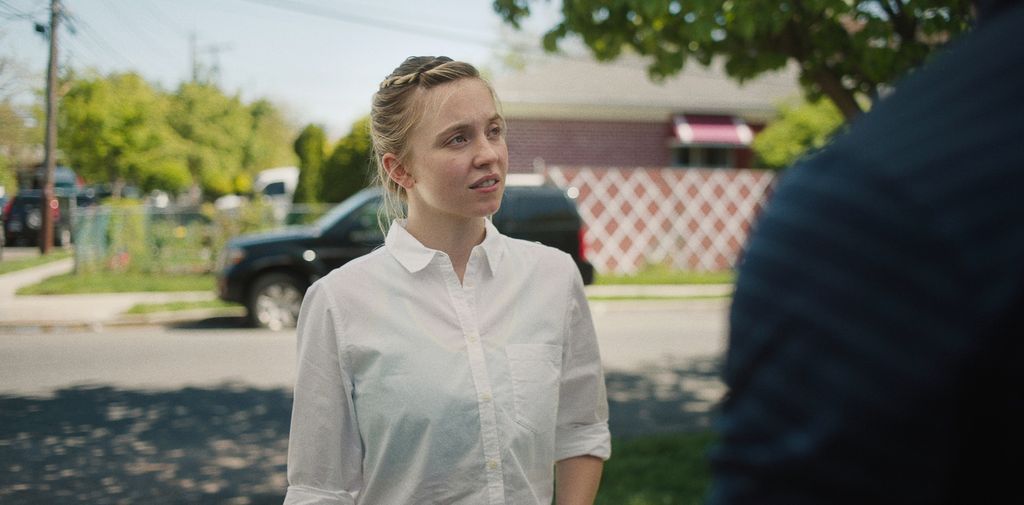 A woman in a white shirt