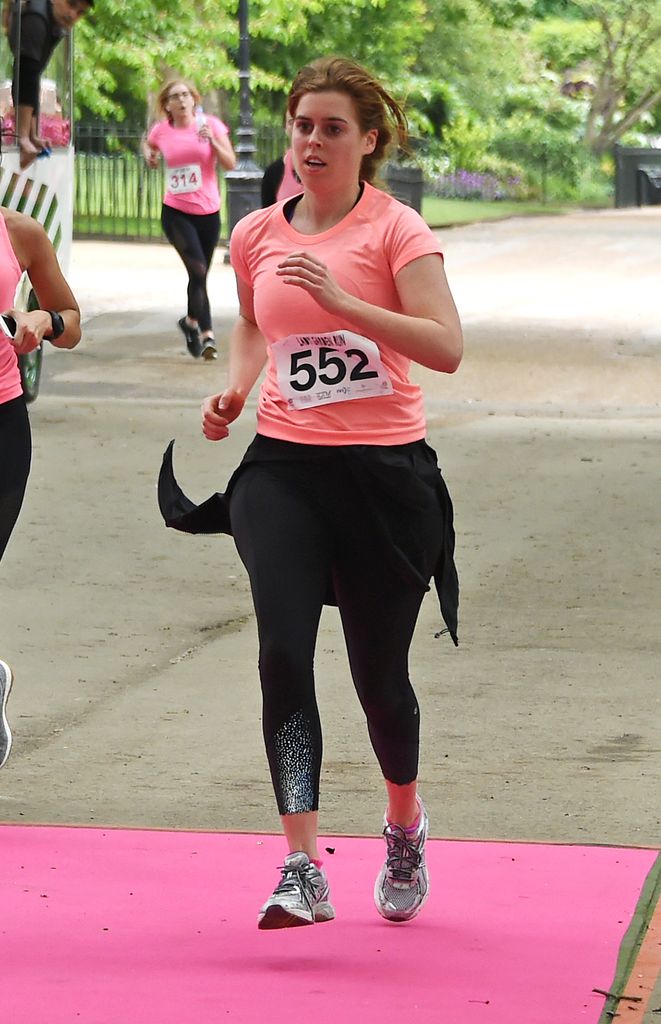 Princess Beatrice running in a coral top