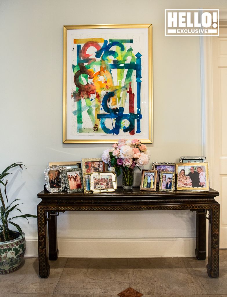  Nancy Davis' hallway with family photo collection at Beverly Hills home in Mulholland Estates