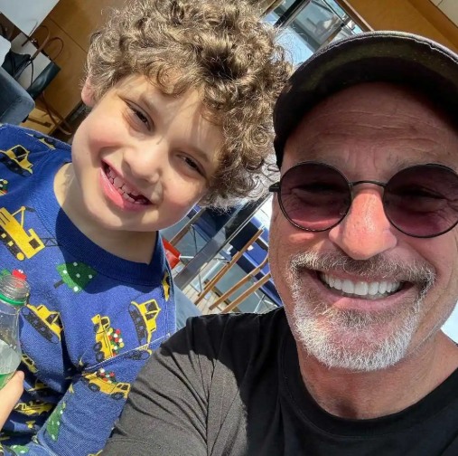 Howie is pictured with his grandson Axel