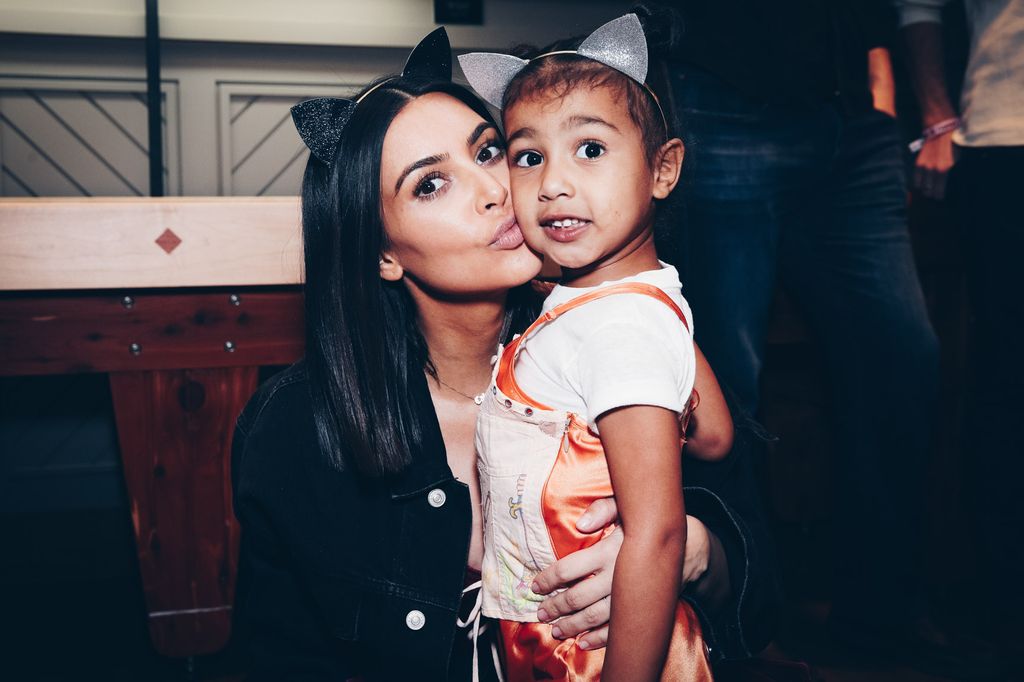Kim kissing her daughter North 