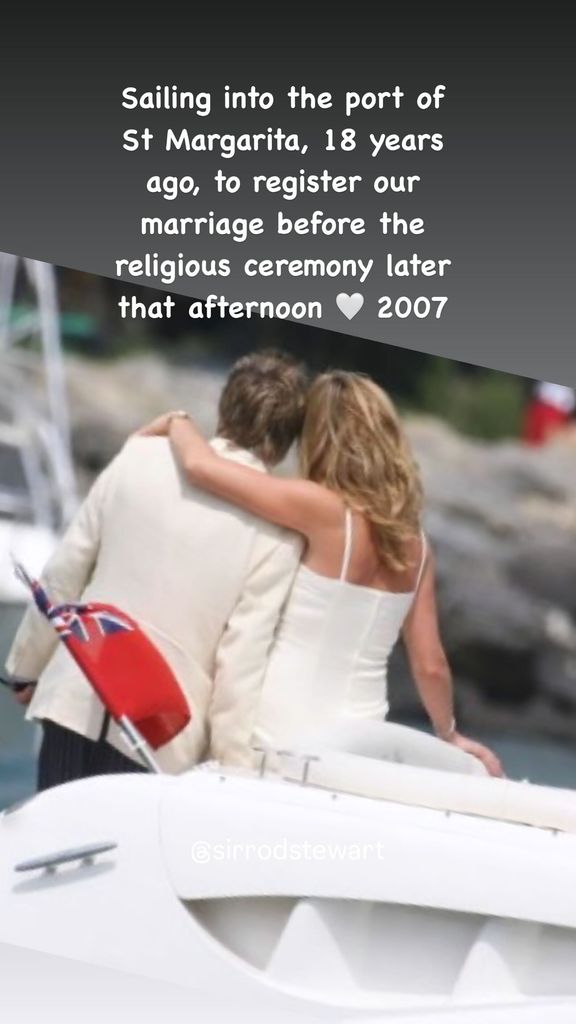 Penny Lancaster with her arm around Rod Stewart on a boat in a white dress