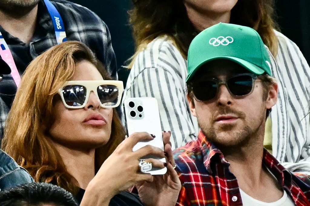 Eva Mendes and Ryan Gosling attend the women's uneven bars final of artistic gymnastics during the Paris 2024 Olympic Games at Bercy Arena on August 4, 2024 in Paris.