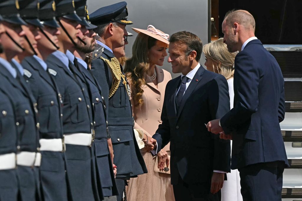 Emmanuel Macron shaking hands with people; Prince William and Kate Middleton are with them