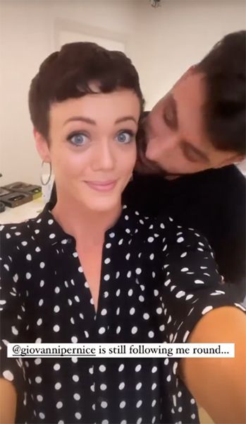 Giovanni Pernice kissing Lauren Oakley on cheek