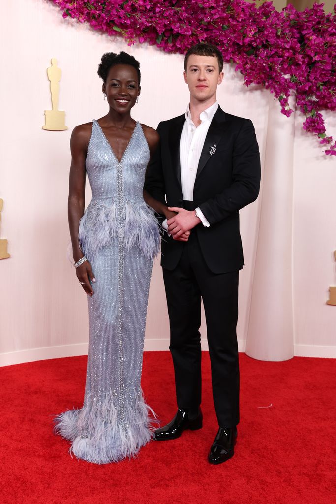 Lupita Nyong'o and Joseph Quinn attend the 96th Annual Academy Awards on March 10, 2024 in Hollywood, California. (Photo by Kevin Mazur/Getty Images)