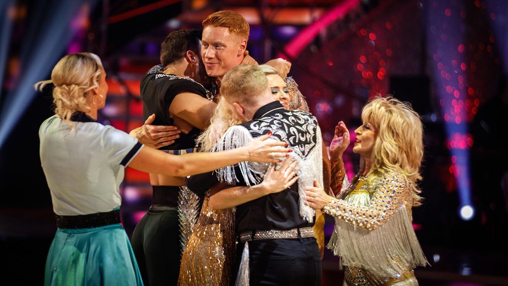 Tom Dean and Nadiya Bychkova hugged by Strictly contestants