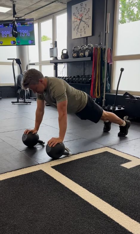 Ben Shephard performing push-ups on a pair of kettlebells