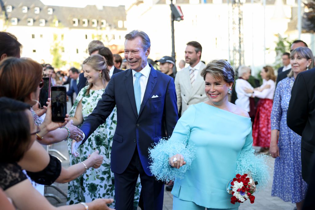 Grand Duchess Maria Teresa looked so stylish in her aquamarine feathered suit 