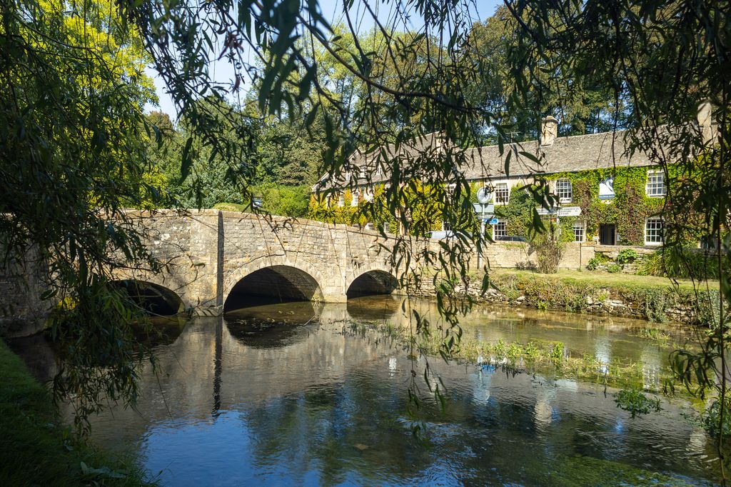 Scenic landscape of Bibury village and River Coln, Cotswolds, Gloucestershire, England, United Kingdom