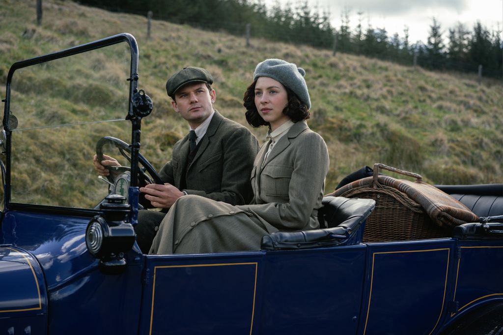 man and woman driving car