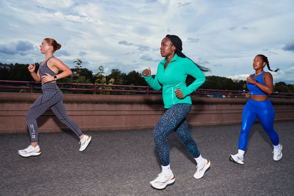 Three women running together