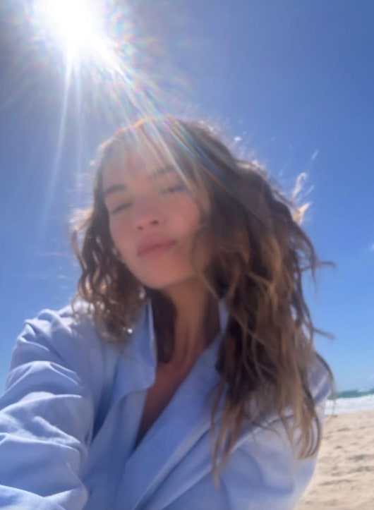 Lily James shared a serene snap of herself at the beach in shirt