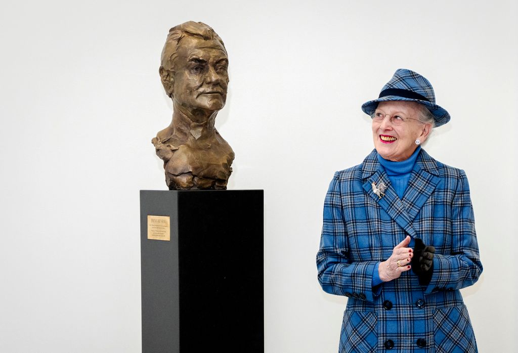 Queen Margrethe wearing blue checked suit unveils bust of her late husband, Prince Henrik
