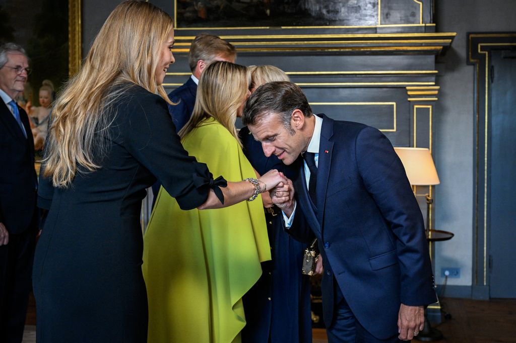 Crown Princess Amalia of the Netherlands (L) greets French President Emmanuel Macron