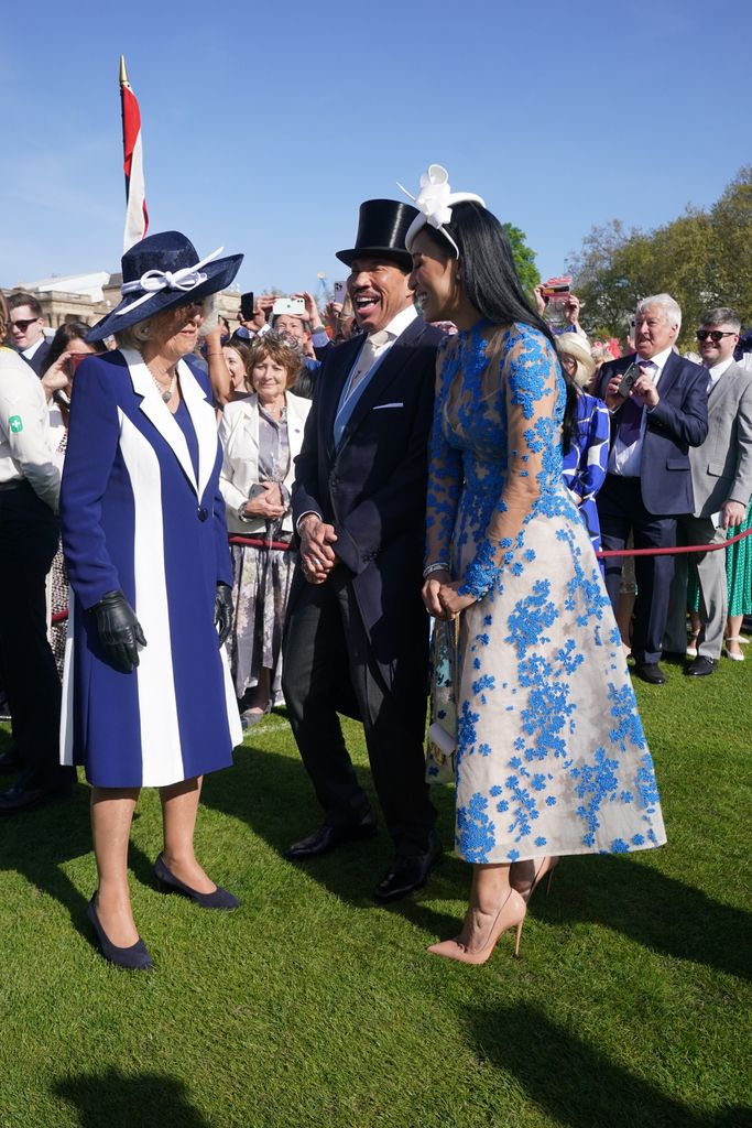 Camilla, Queen Consort speaks to Lionel and Lisa Parigi 
