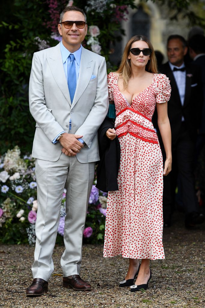 David Walliams in a grey suit and Keeley Hazell in a red dress 