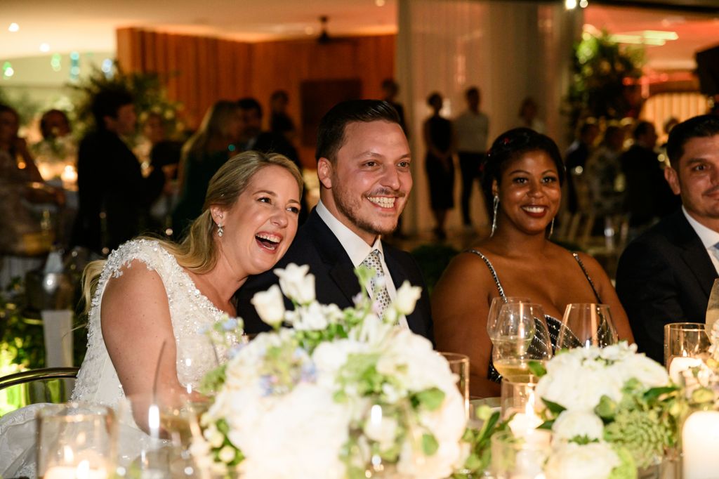 Princess Theodora and Matthew Kumar laughing at the wedding table