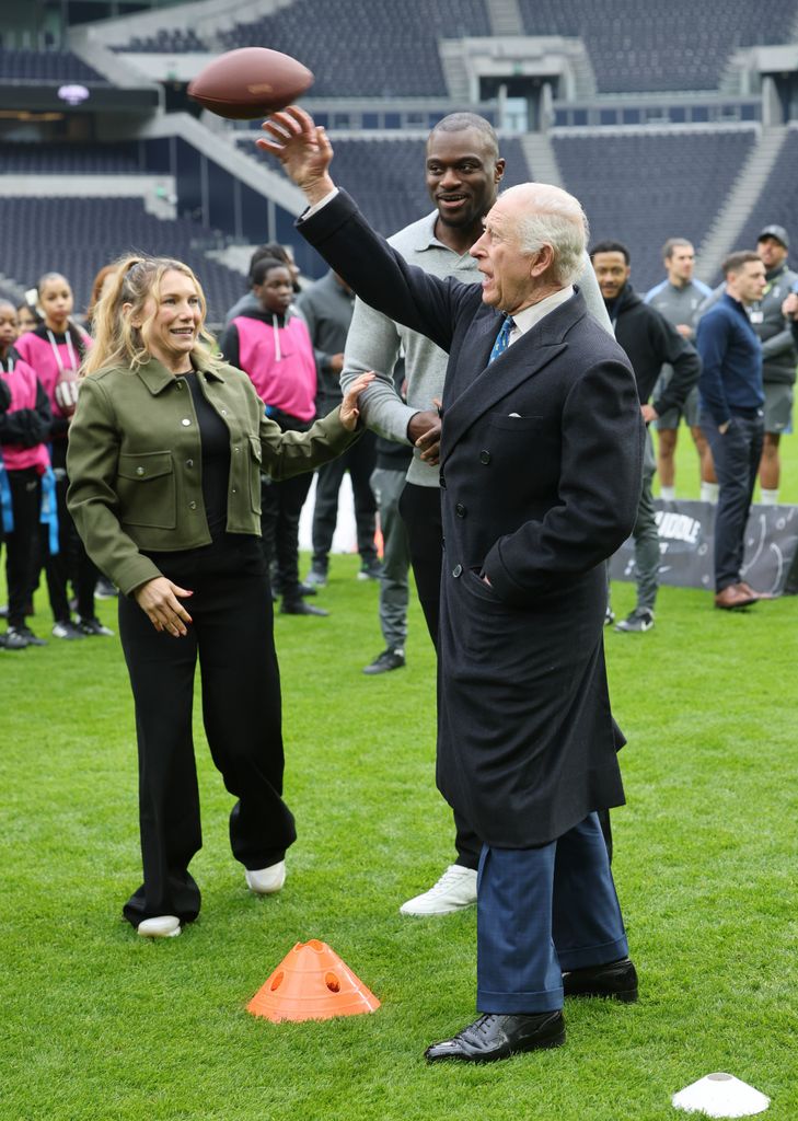 King Charles throws American football