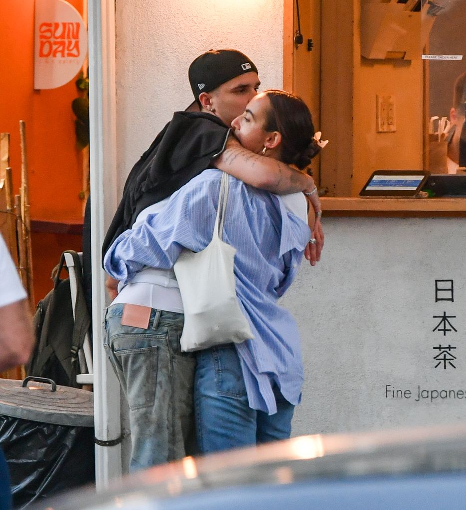 Romeo Beckham and Gray Sorrenti hug