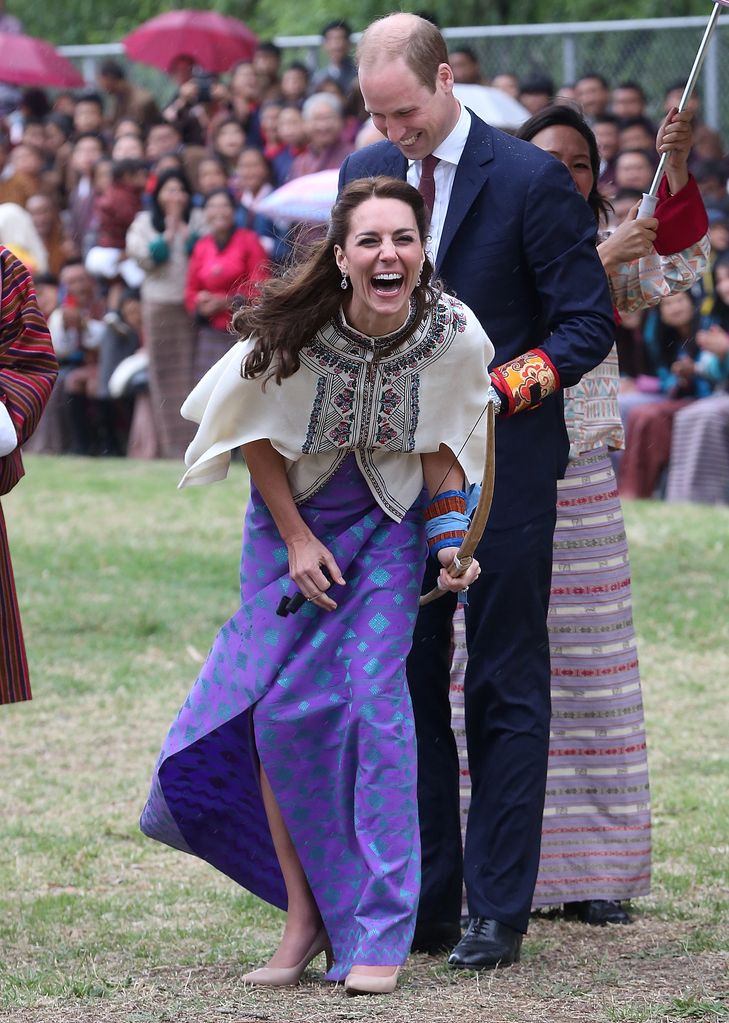 Kate Middleton laughs as she has a go at archery in Bhutan