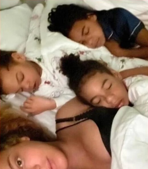 Beyonce and her three children cuddle in bed in cute selfie