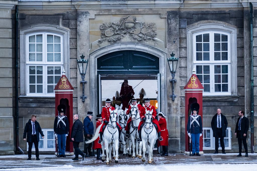 The Golden Carriage with Queen Margrethe inside leaves Amalienborg Palace