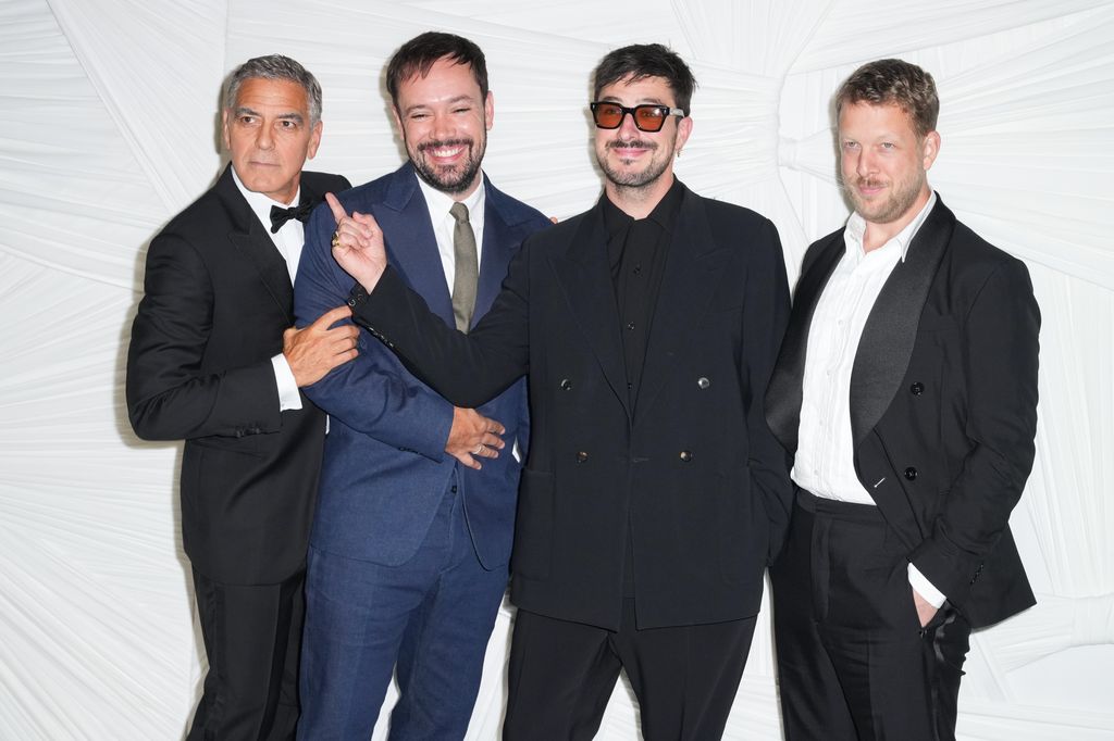 George Clooney with Ben Lovett, Marcus Mumford, Ted Dwane of Mumford and Sons 