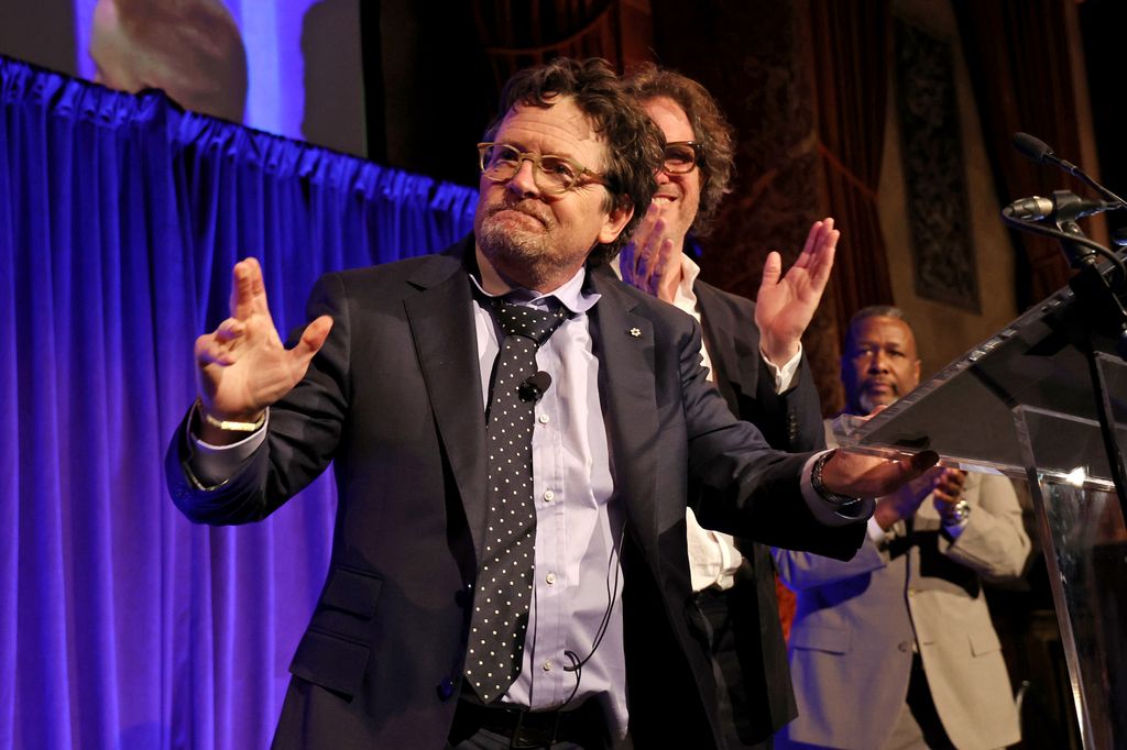Michael J.Fox and Davis Guggenheim accept the Best Documentary award for Still: A Michael J. Fox Movie