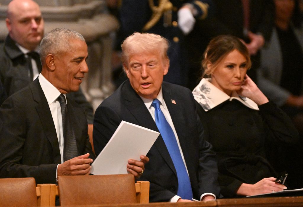 (L-R) Former US President Barack Obama, President-elect Donald Trump and former First Lady Melania Trump arrive to attend the State Funeral Service for former US President Jimmy Carter at the Washington National Cathedral in Washington, DC, on January 9, 2025.