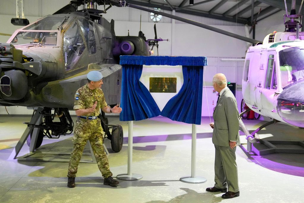 King Charles unveils a plaque at the Army Aviation Centre in Middle Wallop, England