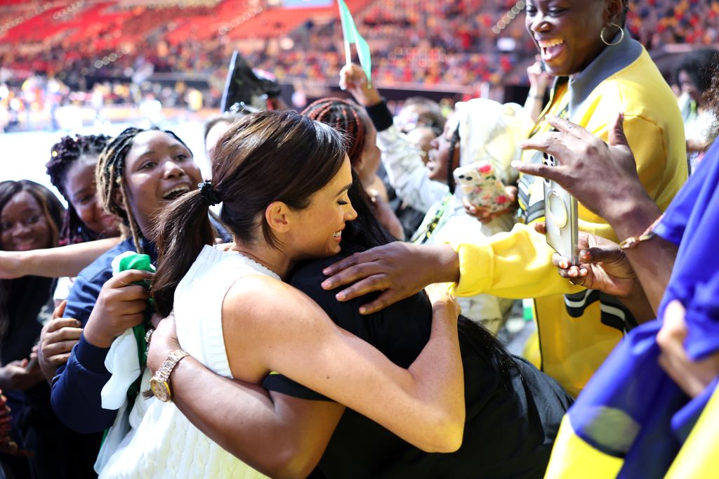 Meghan Markle hugs a Nigerian supporter at the Invictus Games