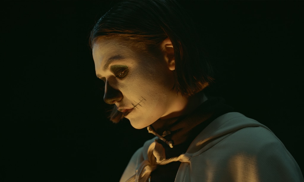 woman wearing skeleton face paint