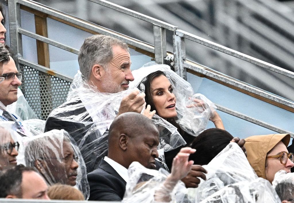 king felipe queen letizia rain ponchos 