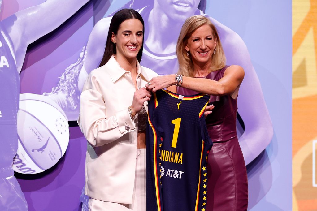 Caitlin Clark poses with WNBA Commissioner Cathy Engelbert after being selected first overall pick by the Indiana Fever during the 2024 WNBA Draft