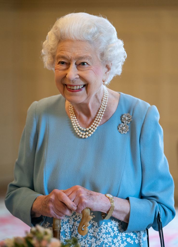 The Queen in a blue outfit