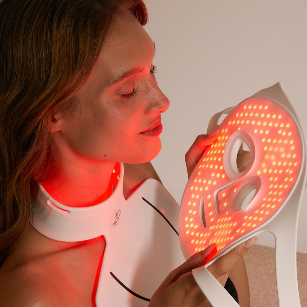 Model putting on LumaLux face mask